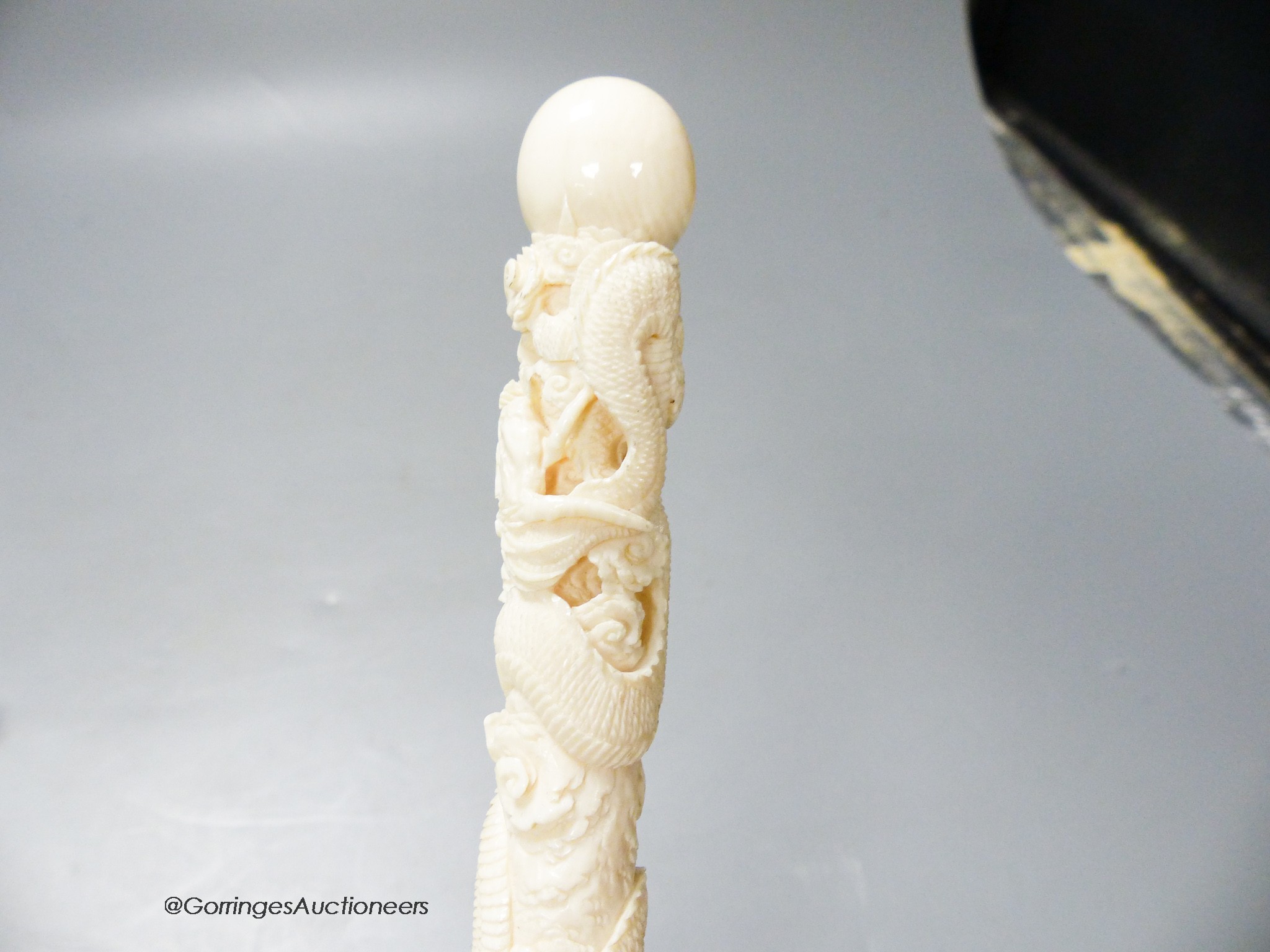 A Japanese ivory 'dragon' parasol handle, early 20th century, signed